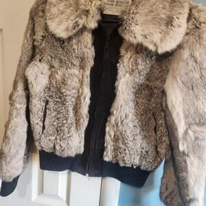 Genuine rabbit fur jacket with black lining and zipper closure
